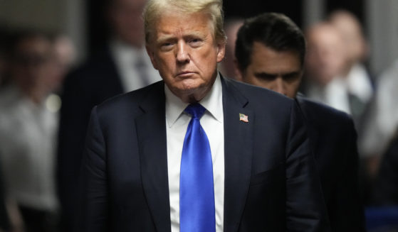 Now-President-elect Donald Trump walks to make comments to members of the media after a jury convicted him of felony crimes for falsifying business records in New York City on May 30, 2024.