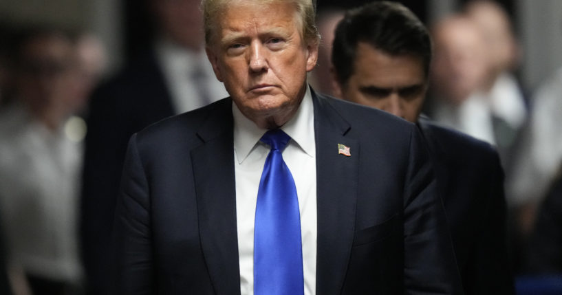 Now-President-elect Donald Trump walks to make comments to members of the media after a jury convicted him of felony crimes for falsifying business records in New York City on May 30, 2024.