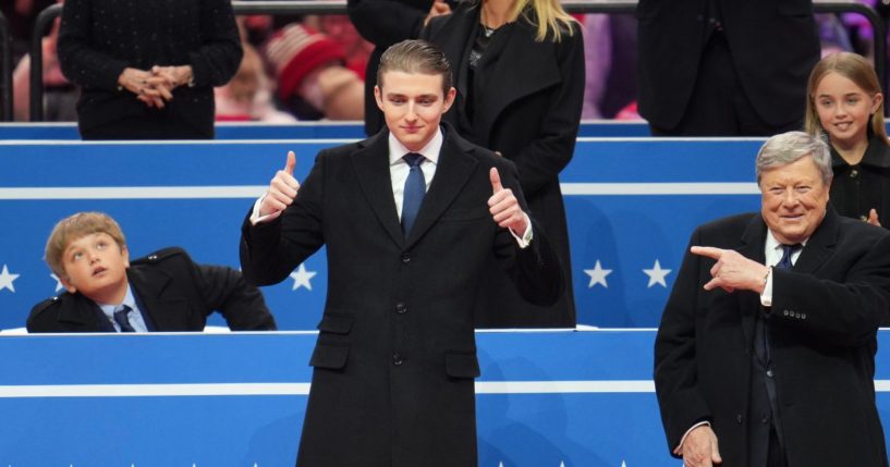 Baron Trump (L) and Viktor Knavs attend an indoor inauguration parade at Capital One Arena on January 20, 2025 in Washington, DC.