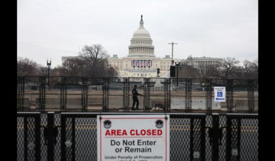 A U.S. Capitol police officer sweeps the area outside the U.S. Capitol with a police dog the day before President-elect Donald Trump's 2nd term inauguration January 19, 2025 in Washington, DC.