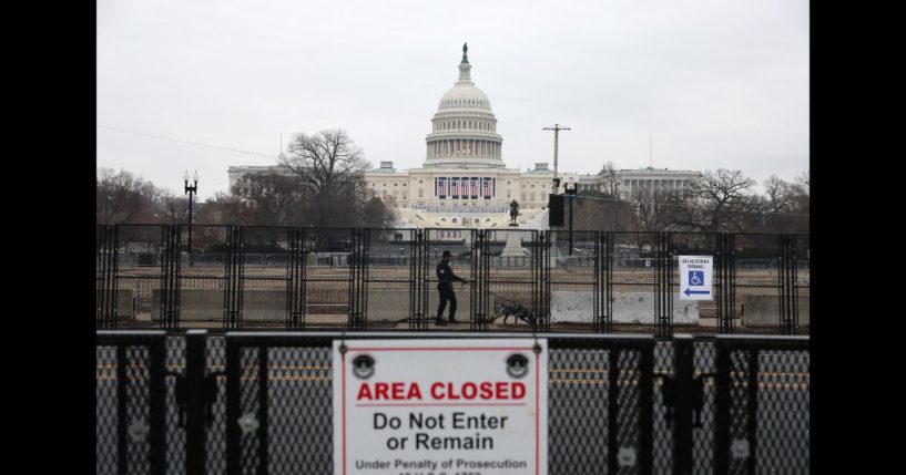 A U.S. Capitol police officer sweeps the area outside the U.S. Capitol with a police dog the day before President-elect Donald Trump's 2nd term inauguration January 19, 2025 in Washington, DC.