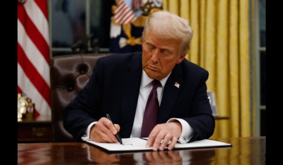 President Donald Trump signs executive orders in the Oval Office of the White House on January 20, 2025 in Washington, DC. Trump takes office for his second term as the 47th president of the United States.