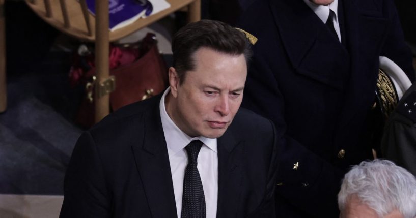 Tesla and SpaceX CEO Elon Musk (C) looks on inside Notre-Dame Cathedral during a ceremony to mark the re-opening of the landmark cathedral, in central, Paris on December 7, 2024.