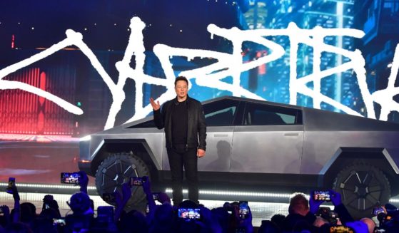 Tesla co-founder and CEO Elon Musk stands in front of the newly unveiled all-electric battery-powered Tesla's Cybertruck at Tesla Design Center in Hawthorne, California on November 21, 2019.