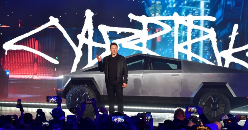 Tesla co-founder and CEO Elon Musk stands in front of the newly unveiled all-electric battery-powered Tesla's Cybertruck at Tesla Design Center in Hawthorne, California on November 21, 2019.