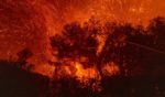 Strong winds blow embers from homes burning in the Eaton Fire on January 7, 2025 in Pasadena, California.