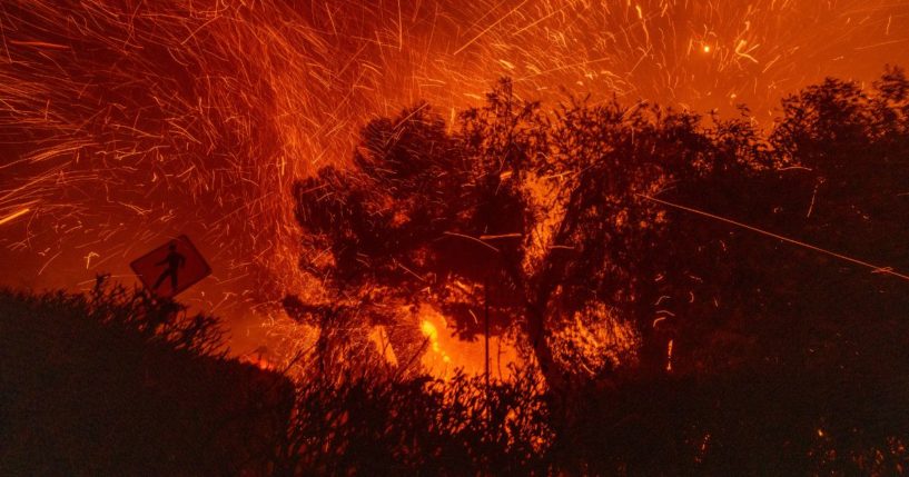 Strong winds blow embers from homes burning in the Eaton Fire on January 7, 2025 in Pasadena, California.