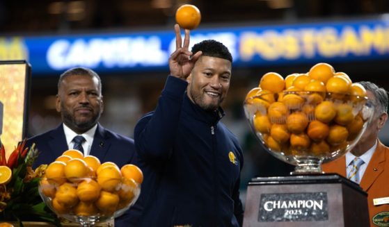 Notre Dame Fighting Irish Head Coach Marcus Freeman celebrates with his team after winning the game against Penn State Nittany Lions at Hard Rock Stadium on January 9, 2025 in Miami Gardens, Florida.