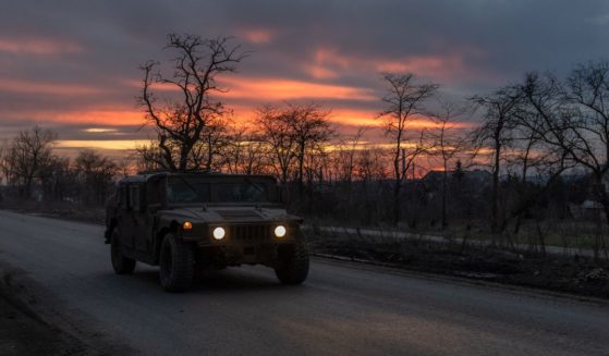 A Ukrainian serviceman drives a US-made Humvee on a road that leads to the town of Chasiv Yar, in the Donetsk region, on March 30, 2024, amid the Russian invasion of Ukraine.