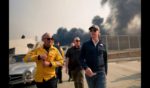 California Governor Gavin Newsom (R) tours the downtown business district of Pacific Palisades as the Palisades Fire continues to burn on January 8, 2025 in Los Angeles, California.