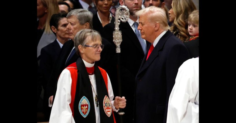 Bishop Mariann Edgar Budde (L) arrives as U.S. President Donald Trump looks on during the National Prayer Service at Washington National Cathedral on January 21, 2025 in Washington, DC.