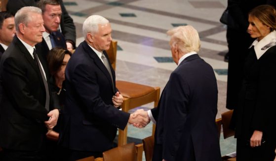 U.S. President-elect Donald Trump greets former U.S. Vice President Mike Pence as he arrives with Melania Trump as former U.S. Vice President Al Gore looks on during the state funeral for former U.S. President Jimmy Carter at Washington National Cathedral on January 9, 2025 in Washington, DC.