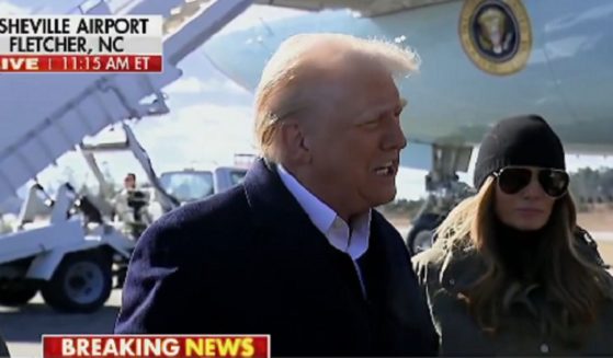 President Donald Trump speaks to reporters Friday in Asheville, North Carolina.