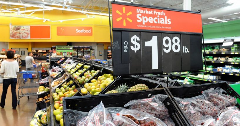 Shoppers search for fruit and vegetable product inside Walmart store, June 1, 2012 in Rosemead, California.