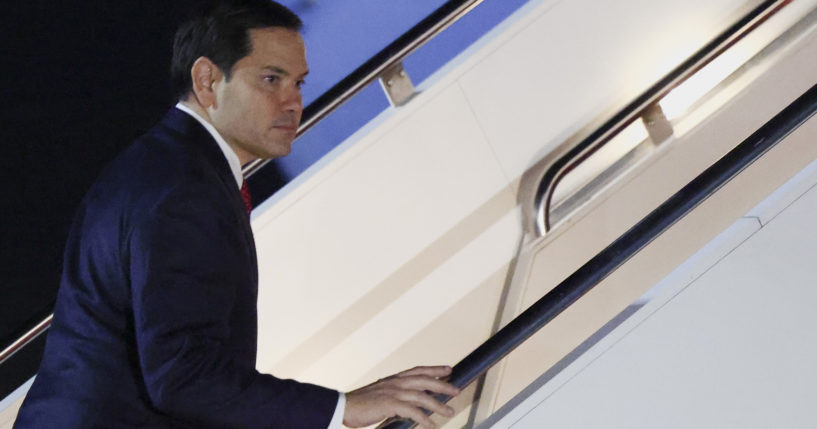 Secretary of State Marco Rubio boards a plane as he departs Joint Base Andrews, Maryland, for the Munich Security Conference on Thursday.