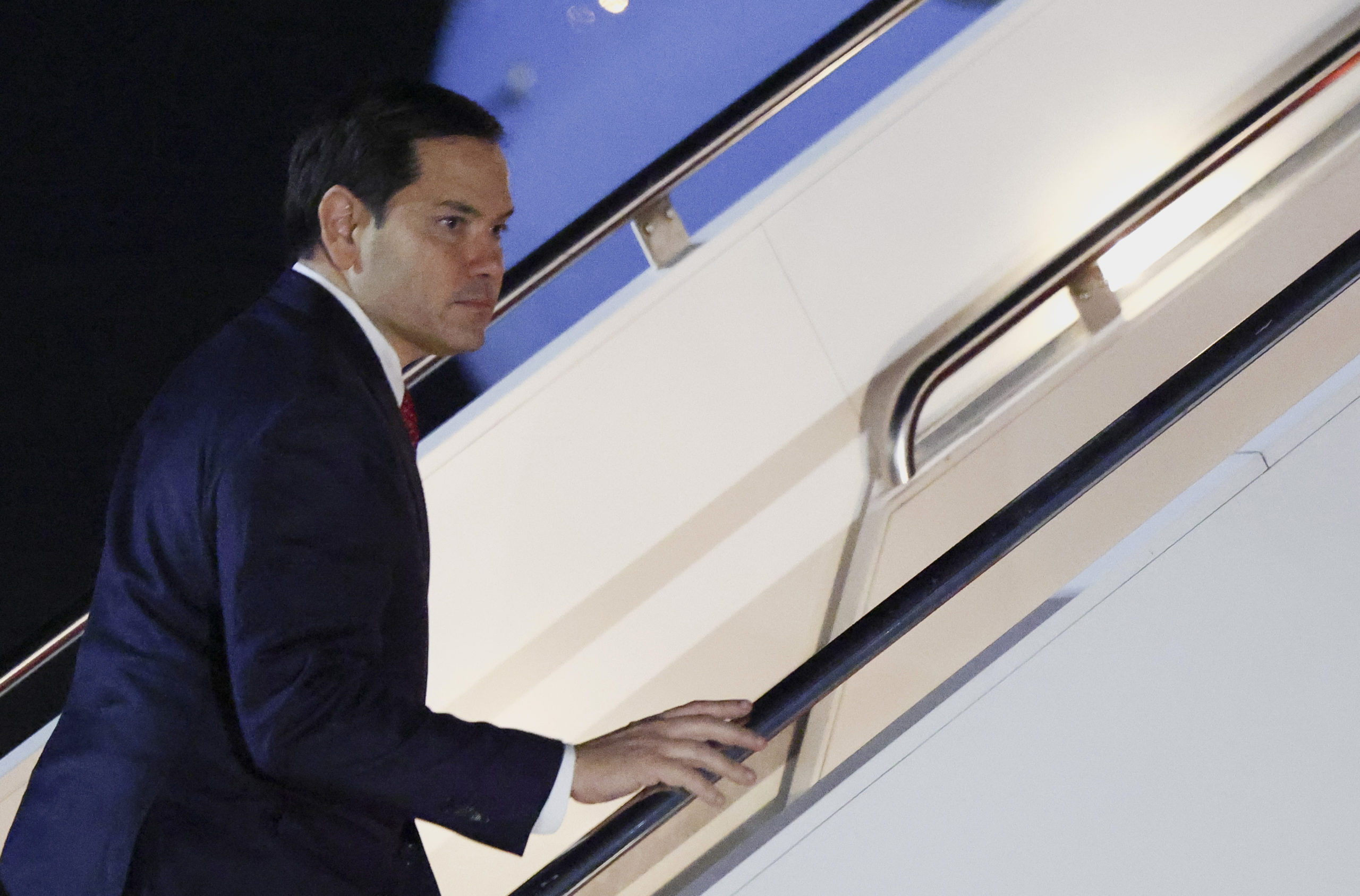 Secretary of State Marco Rubio boards a plane as he departs Joint Base Andrews, Maryland, for the Munich Security Conference on Thursday.