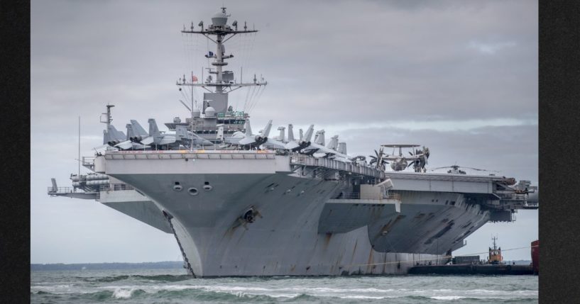 The aircraft carrier USS Harry S. Truman is pictured anchored near Portsmouth, England, in a file photo from Oct. 8, 2018. The nuclear powered aircraft carrier, named after the 33rd President of the United States with a crew of more than 5,000, was involved in a collision with a merchant vessel Wednesday night.