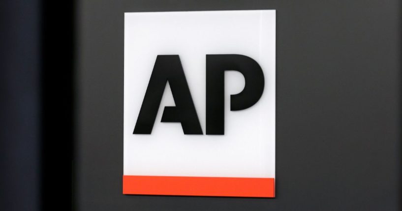 The Associated Press logo is displayed at the company's headquarters in New York on April 18, 2017.