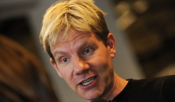 A file picture shows Danish professor Bjorn Lomborg as he speaks with a journalist at the Bella center of Copenhagen on Dec. 15, 2009, on the ninth day of the COP15 UN Climate Change Conference.