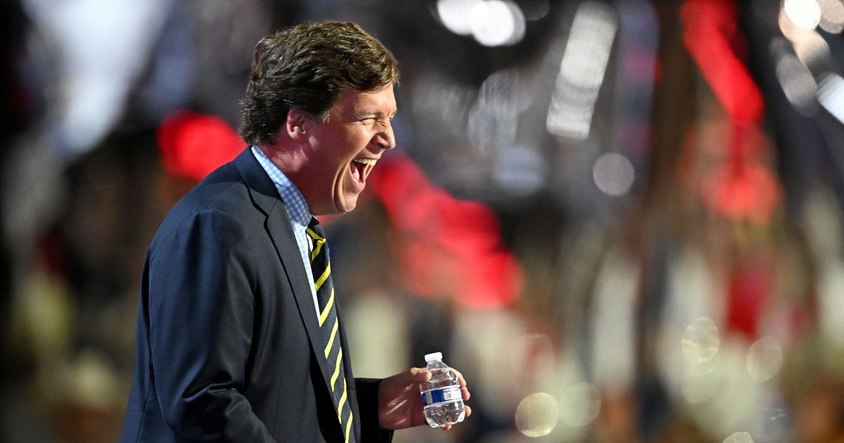 Tucker Carlson, founder of Tucker Carlson Network, arrives to speak on stage on the fourth day of the Republican National Convention at the Fiserv Forum on July 18, 2024, in Milwaukee, Wisconsin.