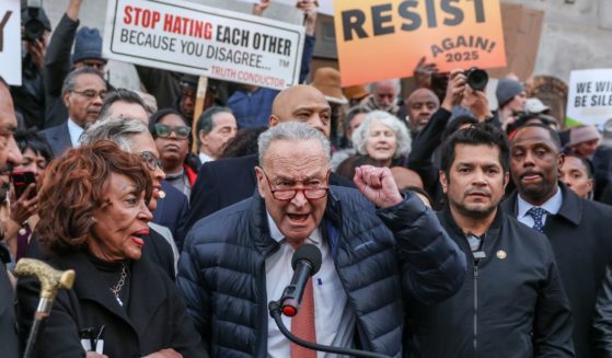 Sen. Chuck Schumer, center, speaks during the We Choose To Fight: Nobody Elected Elon rally at the U.S. Department Of the Treasury in Washington, D.C., on Tuesday.