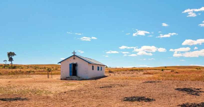 Lonely white single small chapel at flat African land away from Ilakaka town.