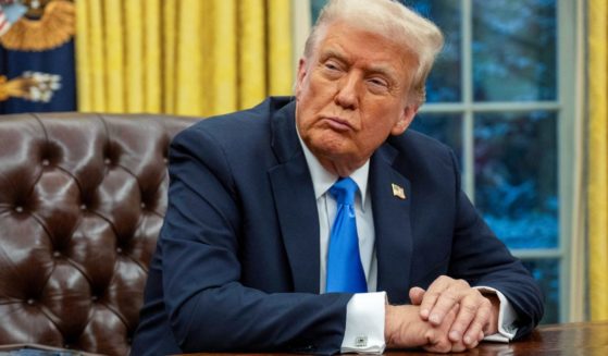 President Donald Trump listens to Elon Musk speak in the Oval Office of the White House in Washington, D.C., on Tuesday.