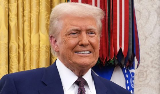 President Donald Trump poses for a photo after Robert Kennedy Jr. was sworn in a secretary of Health and Human Services in the Oval Office at the White House in Washington, D.C., on Thursday.