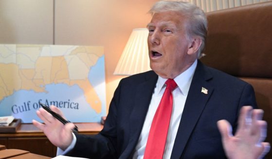 President Donald Trump speaks to reporters before signing a proclamation renaming the Gulf of Mexico as the Gulf of America aboard Air Force One en route to New Orleans, Louisiana, on Feb. 9.