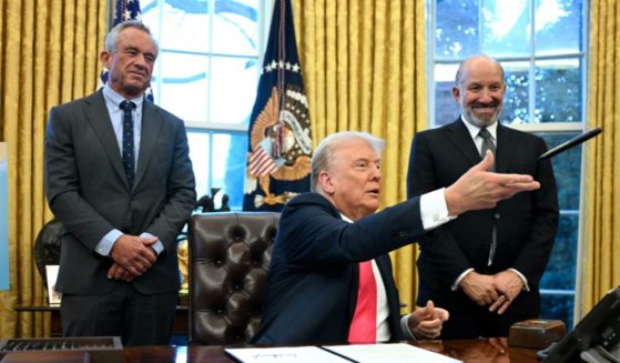 President Donald Trump throws a sharpie after signing an executive order at the Oval Office of the White House in Washington, D.C., on Tuesday.