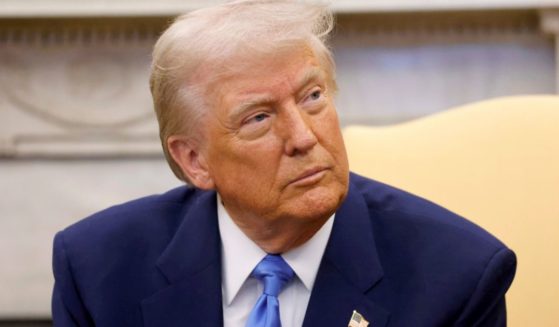 President Donald Trump listens during a meeting with France's President Emmanuel Macron in the Oval Office of the White House in Washington, D.C., on Monday.