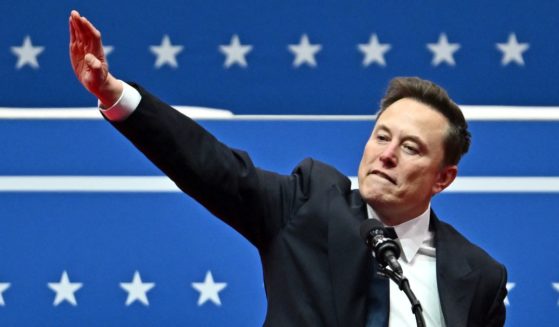 Elon Musk gestures to the audience prior to the inaugural parade inside Capital One Arena in Washington, D.C., on Jan. 20.