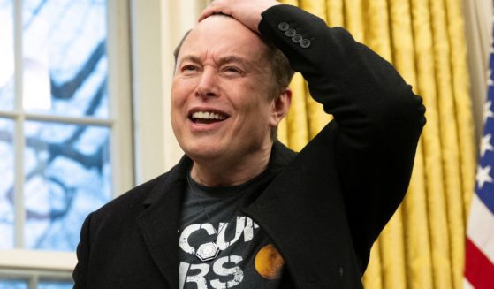 Elon Musk speaks to reporters in the Oval Office at the White House in Washington, D.C., on Feb. 11.