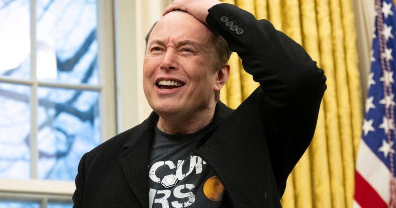 Elon Musk speaks to reporters in the Oval Office at the White House in Washington, D.C., on Feb. 11.