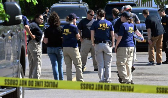 FBI agents are seen near a Tops Grocery store in Buffalo, New York, on May 15, 2022.