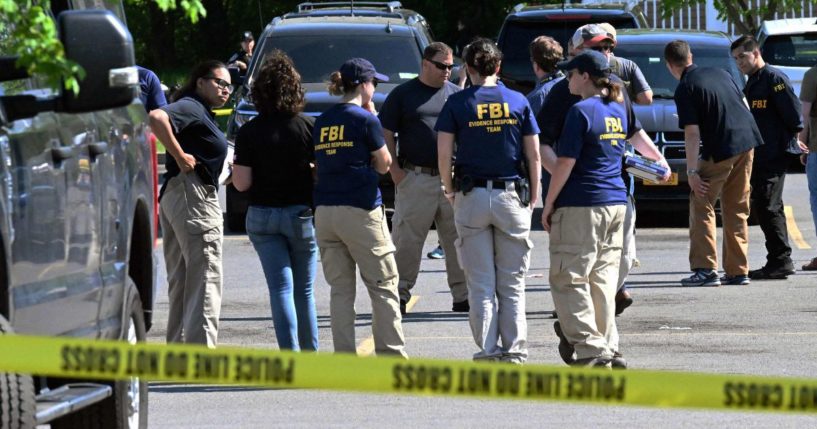 FBI agents are seen near a Tops Grocery store in Buffalo, New York, on May 15, 2022.