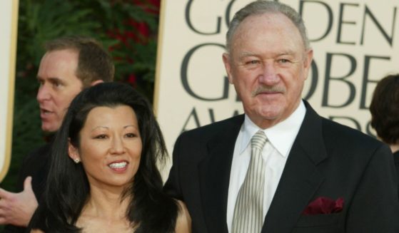 Gene Hackman, right, and Betsy Arakawa, left, arrive for the 60th Annual Golden Globe Awards in Los Angeles, California, on Jan. 19, 2003.