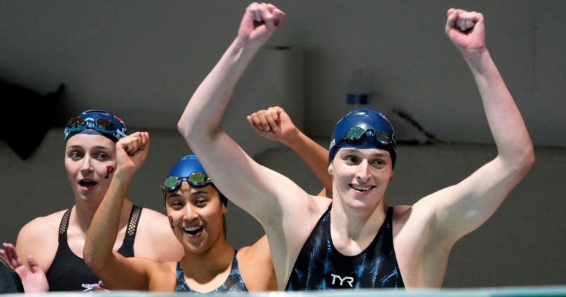 Members of Pennsylvania's 400 yard freestyle relay team, from left, Margot Kaczorowski, Hannah Kannan and Lia Thomas celebrate after winning the race at the Ivy League Women's Swimming and Diving Championships at Harvard University Feb. 19, 2022, in Cambridge, Mass. Kaczorowski is one of three former Ivy League swimmers who filed a suit against the University of Pennsylvania for allowing Thomas to swim as a female on the women's swim team after he completed for two seasons as a male on the school's men's swim team.