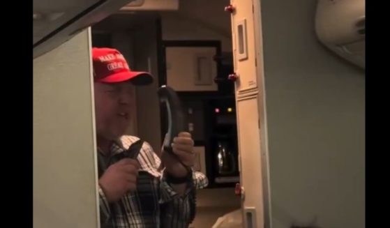 A reported veteran sings "God Bless the USA" over the intercom on a flight leaving Washington, D.C., after the inauguration of President Donald Trump on Jan. 20, 2025.