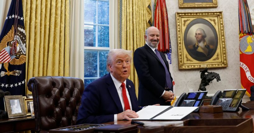 President Donald Trump speaks with reporters in the Oval Office of the White House on Feb. 3, 2025 in Washington.