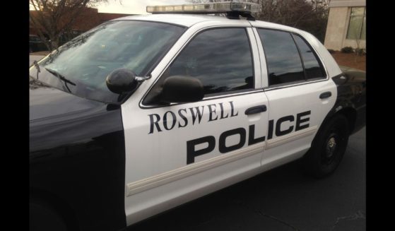 A police car sits near a hospital in Roswell, Georgia in 2015.