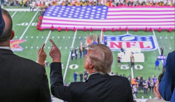 President Donald Trump points up at Super Bowl LIX in New Orleans on Feb. 9, 2025.