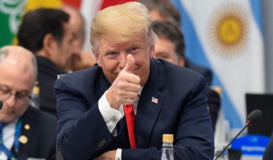 A smiling President Donald Trump gives a thumbs up at the G20 Leaders' Summit in Buenos Aires, on Nov. 30, 2018.