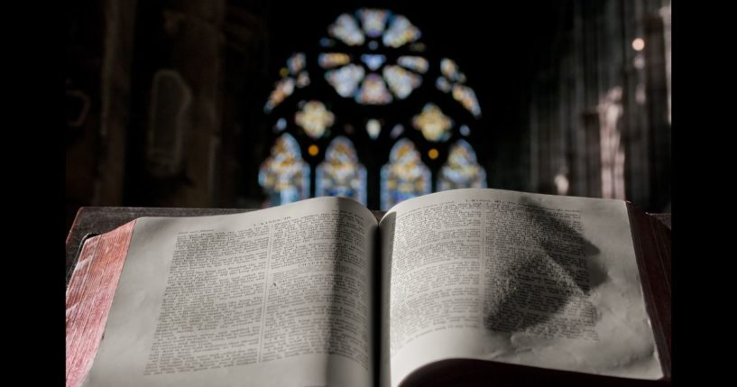 A Bible sits on the pulpit in a church.