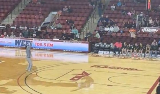 Noah Lee shoots a three-point shot at the University of Massachusetts Amherst women's basketball game on Feb. 5, 2025.