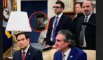 Billionaire Elon Musk (second from right) looks on as President Donald Trump meets with Indian Prime Minister Narendra Modi in the Oval Office of the White House Thursday. Sharp-eyed viewers noticed something interesting hanging on the wall in the adjacent hallway.