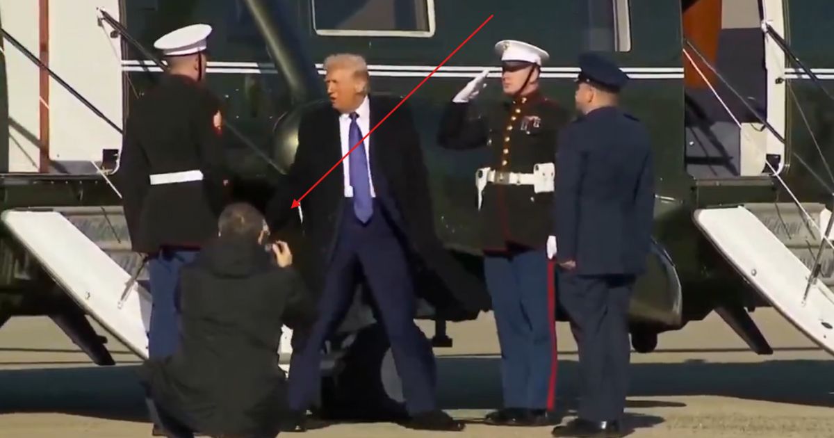 Video Mystery: What in the World Did Trump Hand This Guard When He Got Off Marine One?