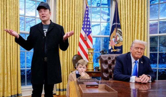 Tesla and SpaceX CEO Elon Musk, accompanied by U.S. President Donald Trump (R), and his son X Musk, speaks during an executive order signing in the Oval Office at the White House on February 11, 2025 in Washington, DC.