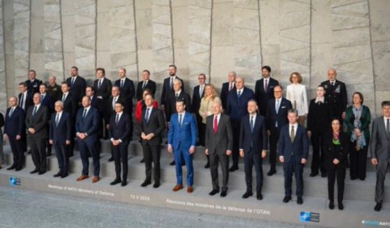 United States Secretary of Defense Pete Hegseth and foreign defense ministers pose for a photograph/