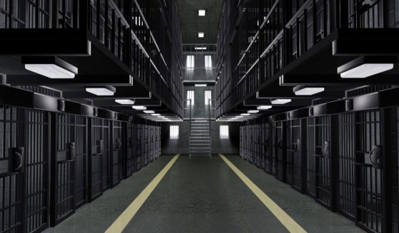 This stock image shows the inside of a prison with empty cells.